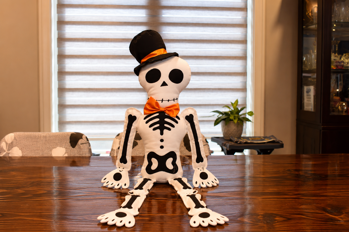 Halloween Skeleton Plush Decoration – 34.65" Sitting Fabric Skeleton with Top Hat & Orange Bow Tie, Poseable Sit-Down Skeleton Decor for Shelf, Mantel & Fireplace
