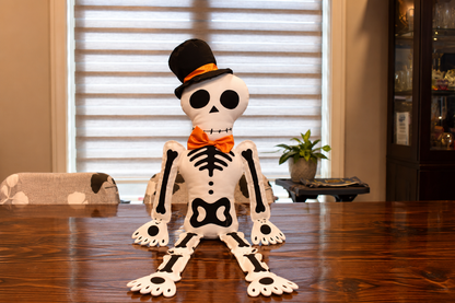 Halloween Skeleton Plush Decoration – 34.65" Sitting Fabric Skeleton with Top Hat & Orange Bow Tie, Poseable Sit-Down Skeleton Decor for Shelf, Mantel & Fireplace